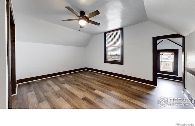 9571 Gray Ave, Carr, CO 80612 - bonus room featuring vaulted ceiling, plenty of natural light, wood finished floors, ceiling fan, and baseboards