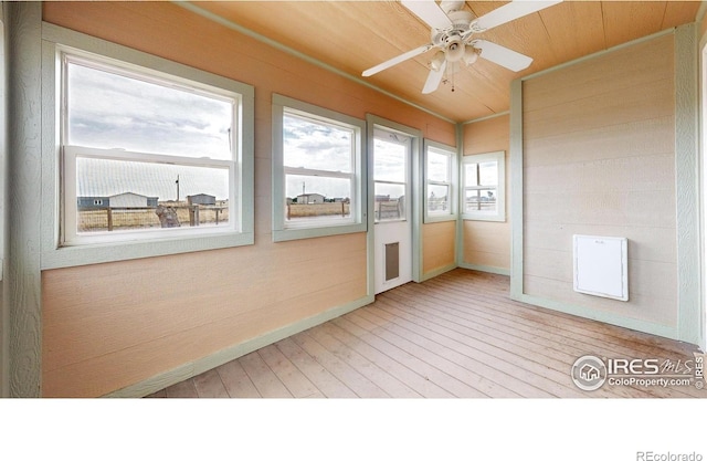 9571 Gray Ave, Carr, CO 80612 - unfurnished sunroom with ceiling fan, hardwood / wood-style floors, and baseboards