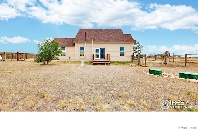 9571 Gray Ave, Carr, CO 80612 - rear view of house with entry steps