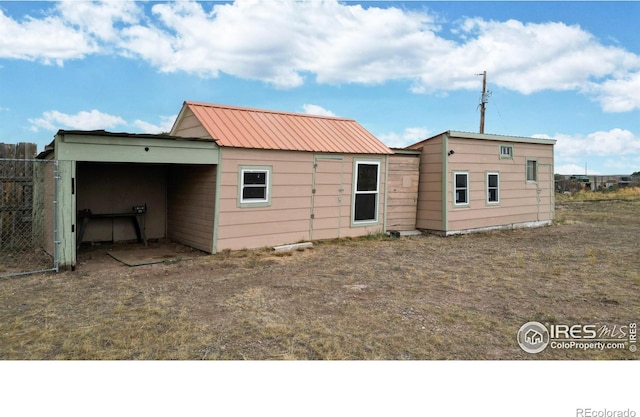 9571 Gray Ave, Carr, CO 80612 - rear view of property featuring metal roof