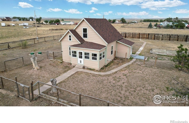 9571 Gray Ave, Carr, CO 80612 - back of house featuring roof with shingles, a gate, a fenced backyard, and a view of countryside