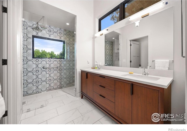 1579 W Costilla Pl, Littleton, CO 80120 - bathroom featuring marble finish floors, double vanity, healthy amount of natural light, and tiled shower
