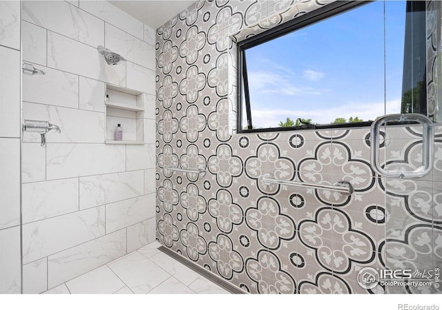 1579 W Costilla Pl, Littleton, CO 80120 - full bath featuring tiled shower and marble look tiles