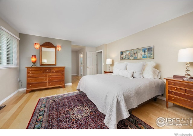 1579 W Costilla Pl, Littleton, CO 80120 - bedroom with light wood-style flooring and baseboards