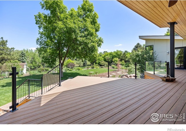 1579 W Costilla Pl, Littleton, CO 80120 - wooden terrace featuring a yard and view of wooded area