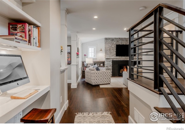 1816 Mariposa Ave, Boulder, CO 80302 - living area with wood finished floors, stairs, lofted ceiling, a stone fireplace, and recessed lighting