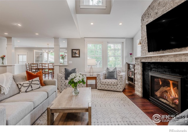 1816 Mariposa Ave, Boulder, CO 80302 - living area featuring dark wood-style floors, a lit fireplace, recessed lighting, and a chandelier