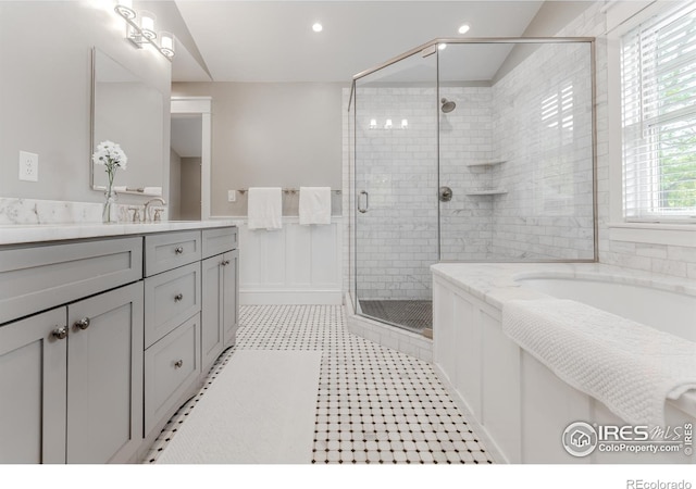 1816 Mariposa Ave, Boulder, CO 80302 - full bath featuring vanity, a bath, a stall shower, a wainscoted wall, and recessed lighting