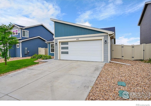 403 Pony Express Trl, Ault, CO 80610 - view of front facade with a gate, driveway, and a garage