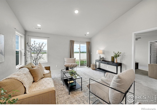 403 Pony Express Trl, Ault, CO 80610 - carpeted living room featuring recessed lighting, a water view, baseboards, and vaulted ceiling