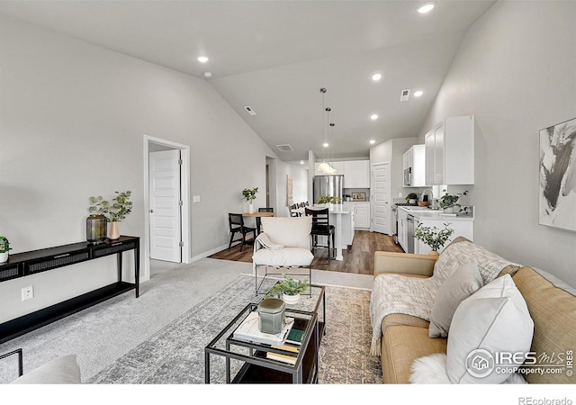 403 Pony Express Trl, Ault, CO 80610 - living area featuring high vaulted ceiling, recessed lighting, and baseboards