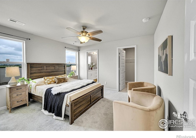 403 Pony Express Trl, Ault, CO 80610 - bedroom featuring light colored carpet, baseboards, ceiling fan, ensuite bathroom, and a spacious closet