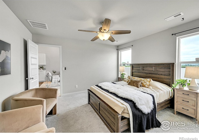 403 Pony Express Trl, Ault, CO 80610 - bedroom featuring light carpet, baseboards, and a ceiling fan