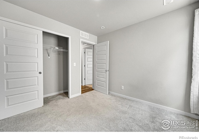 403 Pony Express Trl, Ault, CO 80610 - unfurnished bedroom featuring carpet floors, baseboards, and a closet