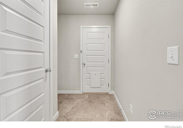 403 Pony Express Trl, Ault, CO 80610 - doorway featuring baseboards and light marble finish flooring