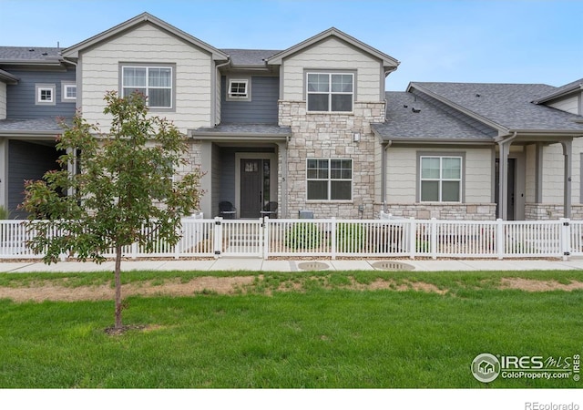 5111 Longshaw Ct Unit 5, Windsor, CO 80528 - view of front of home with stone siding and a shingled roof