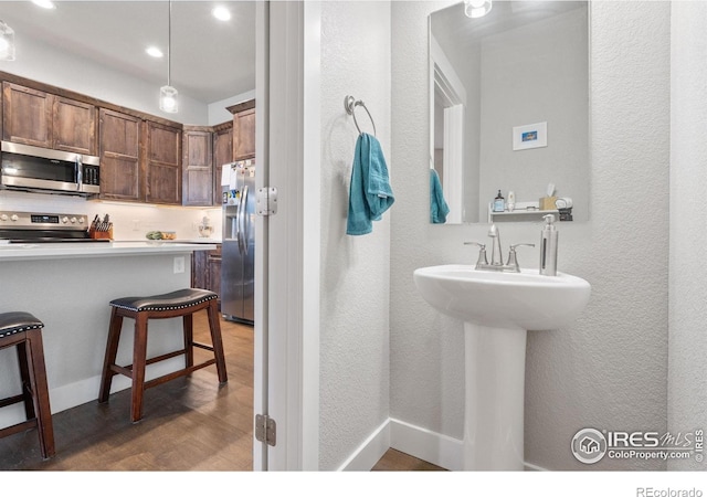 5111 Longshaw Ct Unit 5, Windsor, CO 80528 - bathroom featuring wood finished floors and recessed lighting