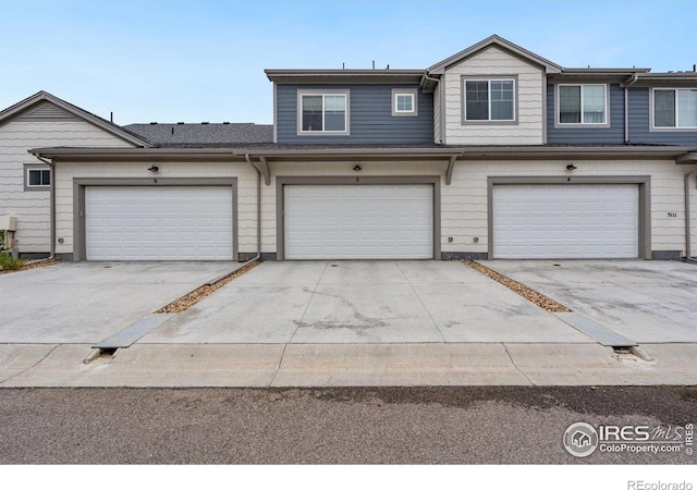5111 Longshaw Ct Unit 5, Windsor, CO 80528 - multi unit property featuring driveway and an attached garage