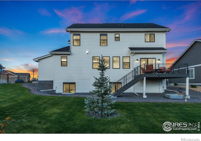 7061 Sage Meadows Dr, Wellington, CO 80549 - back of house featuring a wooden deck, a yard, and stairs