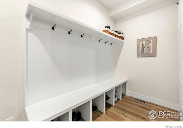 7061 Sage Meadows Dr, Wellington, CO 80549 - mudroom with light wood finished floors and baseboards