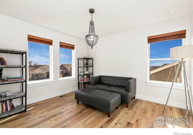 7061 Sage Meadows Dr, Wellington, CO 80549 - sitting room featuring wood finished floors and baseboards