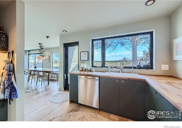 456 W Sycamore Ct, Louisville, CO 80027 - kitchen with dishwasher, a sink, and light wood finished floors