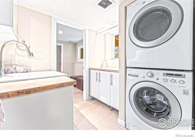279 Green Meadow Ln, Boulder, CO 80302 - laundry area with stacked washing machine and dryer