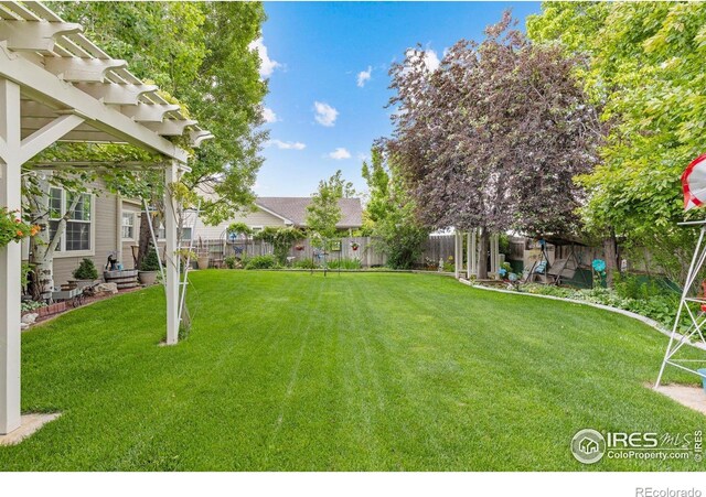 3023 39th Ave, Evans, CO 80620 - view of yard featuring a pergola