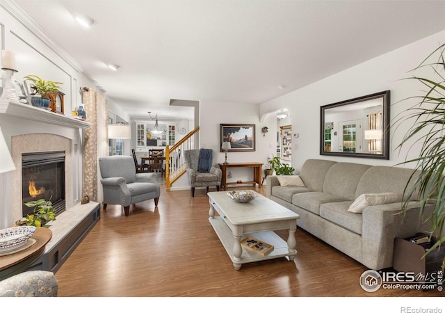 3023 39th Ave, Evans, CO 80620 - living area with wood finished floors, a fireplace, and stairway