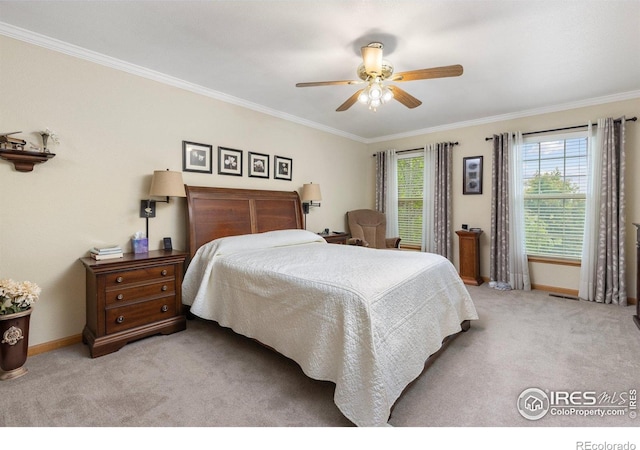 3023 39th Ave, Evans, CO 80620 - carpeted bedroom featuring crown molding, baseboards, and ceiling fan