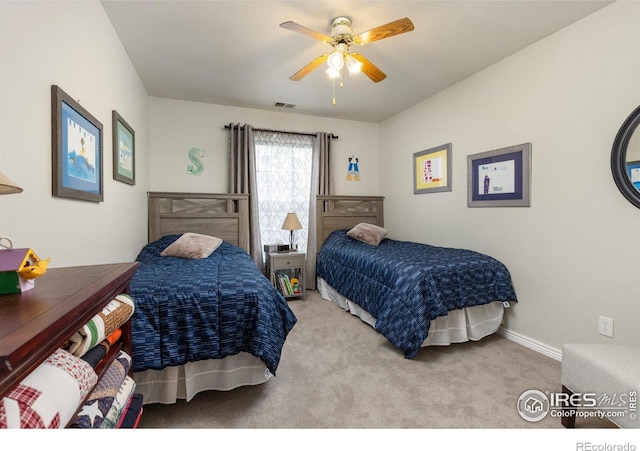3023 39th Ave, Evans, CO 80620 - bedroom with carpet, a ceiling fan, and baseboards