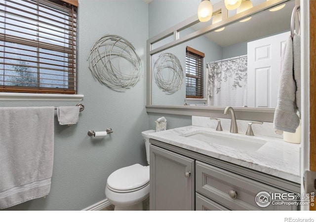 3023 39th Ave, Evans, CO 80620 - full bathroom with vanity and toilet