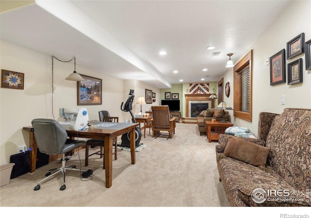 3023 39th Ave, Evans, CO 80620 - home office with light colored carpet, a glass covered fireplace, and recessed lighting