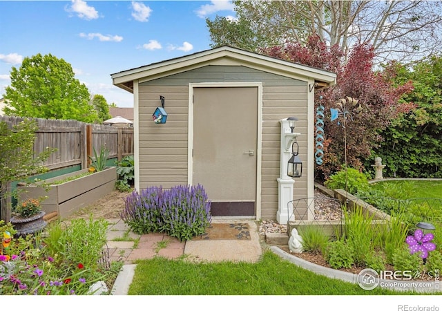 3023 39th Ave, Evans, CO 80620 - view of shed featuring a vegetable garden