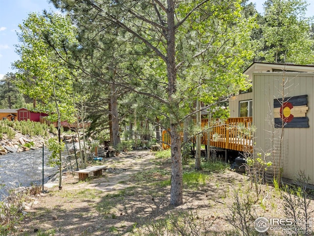 135 Canyon River Rd, Drake, CO 80515 - view of yard featuring a deck