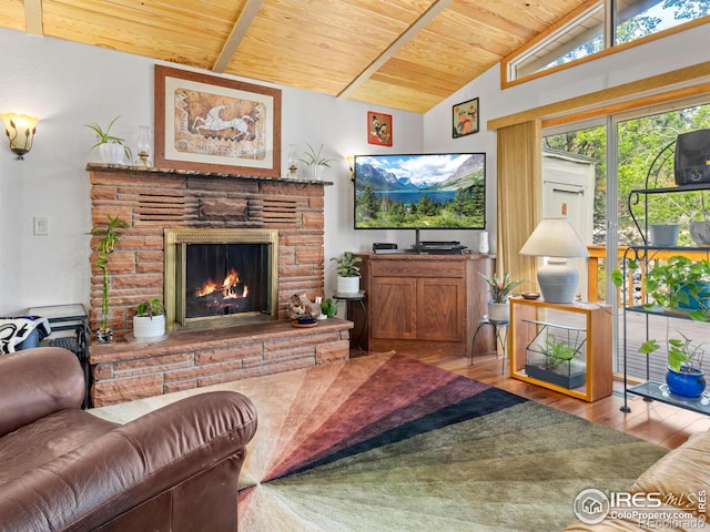 135 Canyon River Rd, Drake, CO 80515 - living room with wooden ceiling, a lit fireplace, and wood finished floors