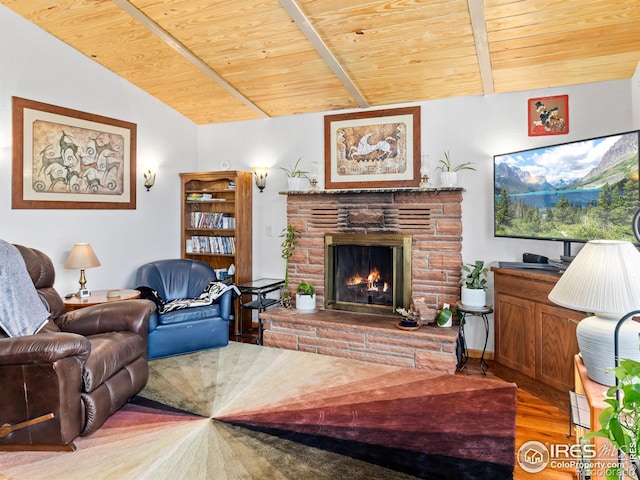 135 Canyon River Rd, Drake, CO 80515 - living area with wood ceiling, wood finished floors, and a warm lit fireplace