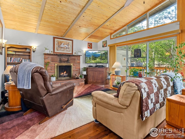 135 Canyon River Rd, Drake, CO 80515 - living area with wood ceiling with exposed beams, wood finished floors, a lit fireplace, and high vaulted ceiling
