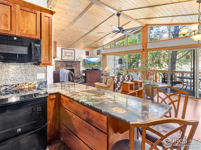 135 Canyon River Rd, Drake, CO 80515 - kitchen featuring wooden ceiling with exposed beams, black microwave, a fireplace, a peninsula, and range