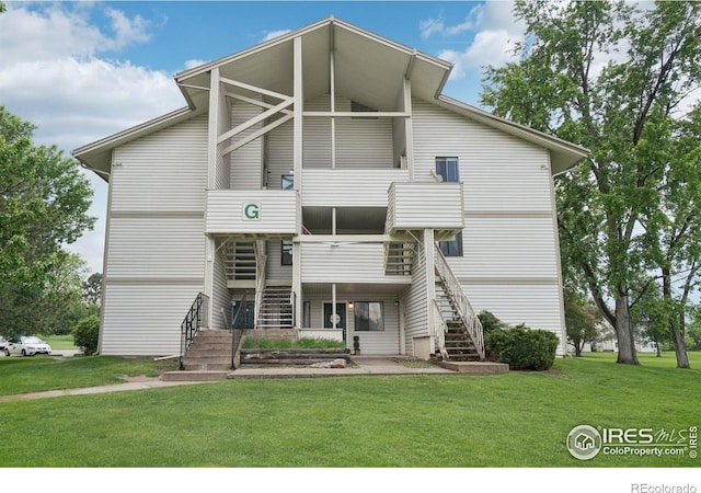 1705 Heatheridge Rd Unit G105, Fort Collins, CO 80526 - view of front of house with stairway and a front lawn