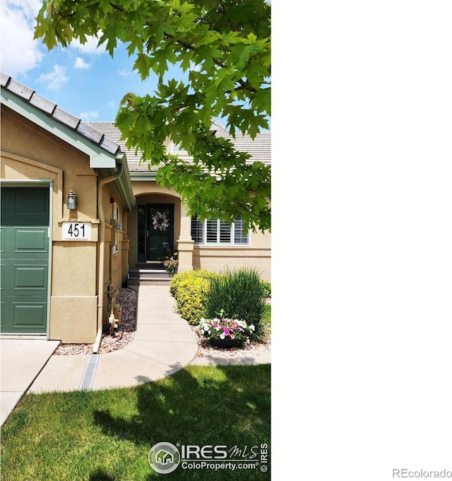 451 Clubhouse Ct, Loveland, CO 80537 - view of exterior entry featuring stucco siding