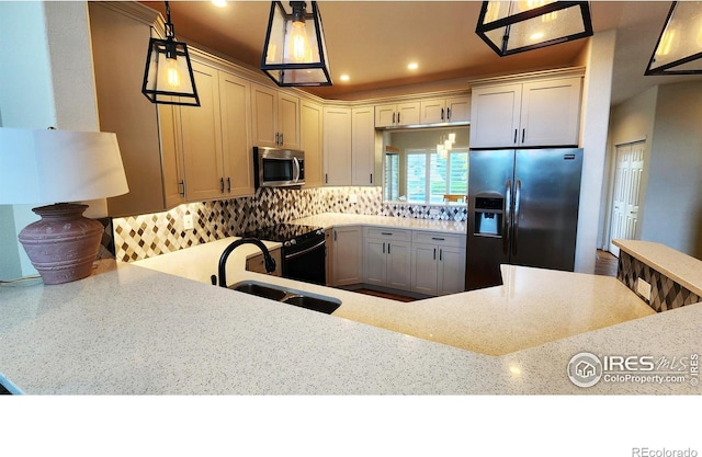 451 Clubhouse Ct, Loveland, CO 80537 - kitchen with appliances with stainless steel finishes, a sink, light stone countertops, decorative backsplash, and recessed lighting