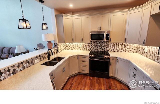 451 Clubhouse Ct, Loveland, CO 80537 - kitchen with electric stove, stainless steel microwave, a sink, tasteful backsplash, and recessed lighting