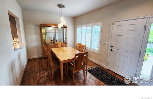 451 Clubhouse Ct, Loveland, CO 80537 - dining area featuring wood finished floors, baseboards, and a chandelier