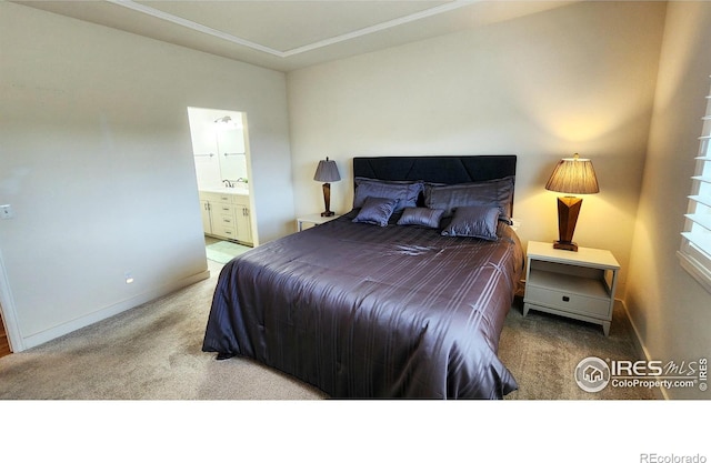 451 Clubhouse Ct, Loveland, CO 80537 - carpeted bedroom featuring baseboards, connected bathroom, and ornamental molding