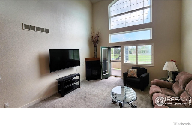 451 Clubhouse Ct, Loveland, CO 80537 - carpeted living room with a high ceiling and baseboards