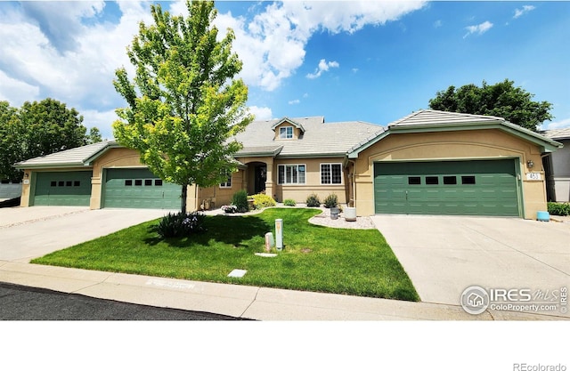 451 Clubhouse Ct, Loveland, CO 80537 - single story home with driveway, an attached garage, stucco siding, a front yard, and a tile roof