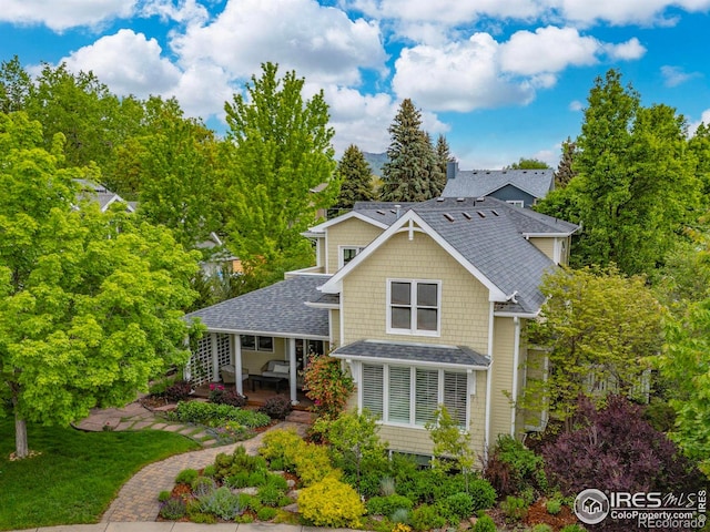 1509 Poplar Ave, Boulder, CO 80304 - view of front of home with roof with shingles and a front lawn