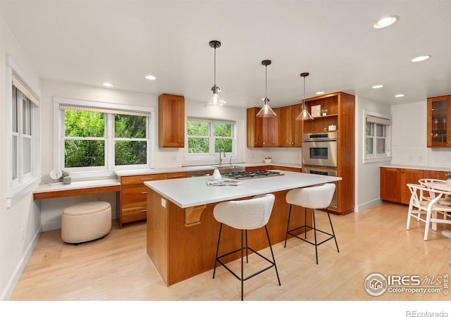 1509 Poplar Ave, Boulder, CO 80304 - kitchen with brown cabinets, light wood finished floors, gas cooktop, open shelves, and recessed lighting