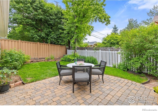 1509 Poplar Ave, Boulder, CO 80304 - fenced backyard featuring a patio area and outdoor dining space